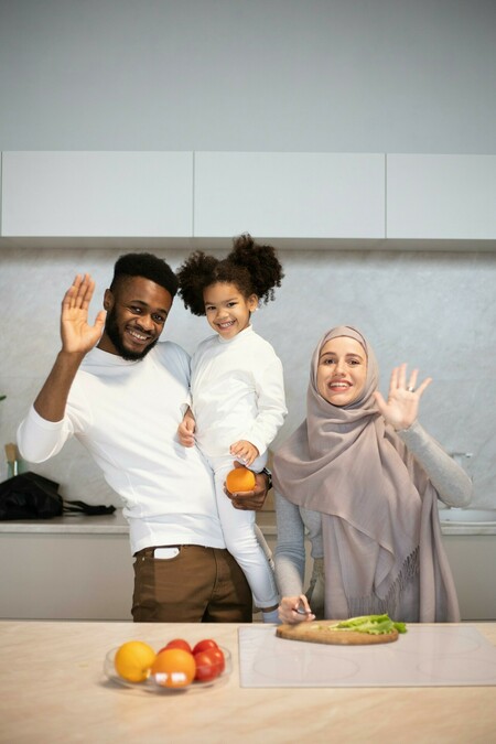 Family preparing a meal with fruit and vegetables